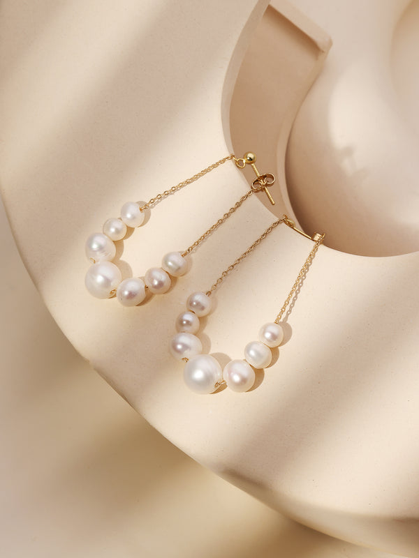 Handmade earrings made of natural pearls